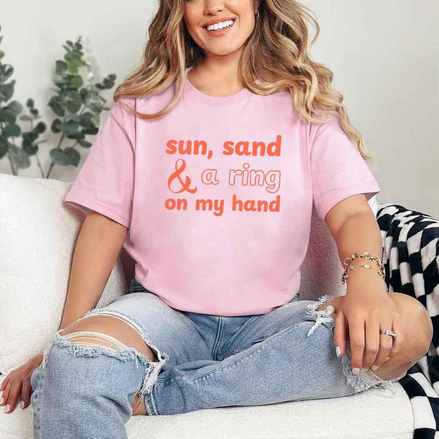 May include Pink beach themed wedding party t-shirts with Sun Sand and A Ring On My Hand slogan, tropical colors, bridal group apparel for summer celebrations!
