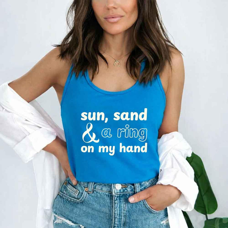 May include a Turquoise tank top with the phrase “Sun Sand & A Ring On My Hand” in a stylish summer font, ideal for brides.