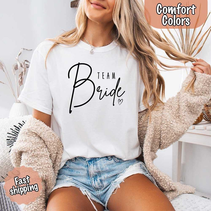 White soft Comfort Colors t-shirts with "Team Bride" design, perfect for the bride, bridesmaids, or bachelorette party, featuring stylish lettering for bridal proposals and celebrations.
