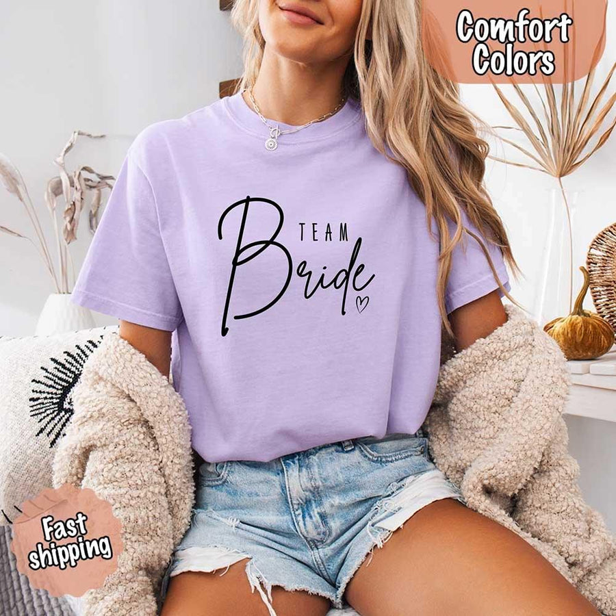 Lavender soft Comfort Colors t-shirts with "Team Bride" design, perfect for the bride, bridesmaids, or bachelorette party, featuring stylish lettering for bridal proposals and celebrations.