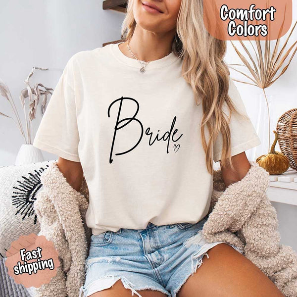 White Soft Comfort Colors t-shirts with "Bride" design, perfect for the bride, bridesmaids, or bachelorette party, featuring stylish lettering for bridal proposals and celebrations.
