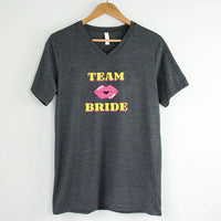 May include Team Bride & The Bride matching V-Neck T-Shirts for bachelorette party, with designs for bride and bridesmaids.