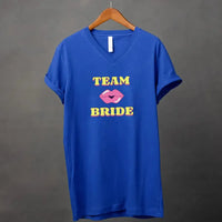May include Team Bride & The Bride matching V-Neck T-Shirts for bachelorette party, with designs for bride and bridesmaids.