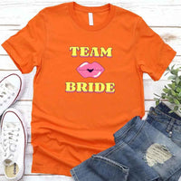 May include Orange Team Bride & The Bride Bachelorette Party Matching T-Shirts, featuring "Team Bride" and "The Bride" designs in soft cotton fabric, perfect for pre-wedding celebrations and group photos.