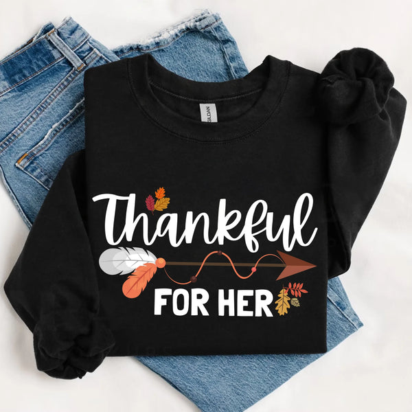 May include a pair of matching Thanksgiving sweatshirts featuring “Thankful For Her” and “Thankful For Him” text, styled for couples celebrating the holiday together.