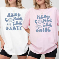 May include a bachelorette-themed T-shirt reading “Vino Before Vows,” featuring playful typography and celebratory bridal party design elements !