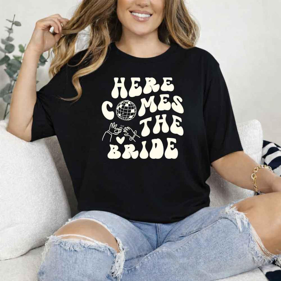 May include Black bachelorette-themed T-shirt reading “Vino Before Vows,” featuring playful typography and celebratory bridal party design elements!
