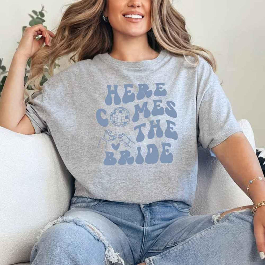 May include Sport Grey bachelorette-themed T-shirt reading “Vino Before Vows,” featuring playful typography and celebratory bridal party design elements!