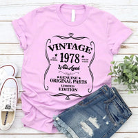 May include a personalized vintage-style birthday T-shirt with the words Well Aged and a custom year printed on the front.