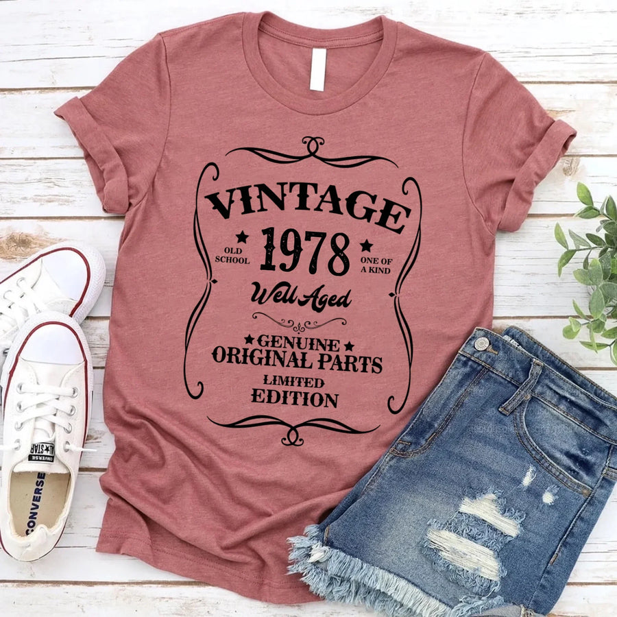 May include a personalized vintage-style birthday T-shirt with the words Well Aged and a custom year printed on the front.