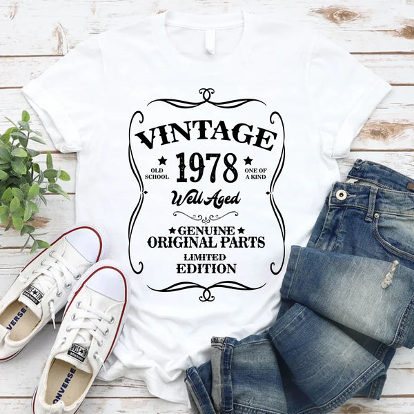 May include a personalized vintage-style birthday T-shirt with the words Well Aged and a custom year printed on the front.