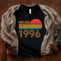 May include a personalized vintage-style t-shirt with a retro sun graphic and customizable year text printed on the front.