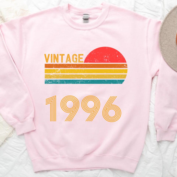 May include a personalized vintage-style sweatshirt with a retro sun graphic and customizable year text printed on the front.