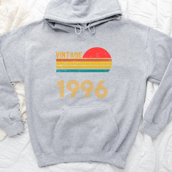 May include a personalized vintage-style hoodie with a retro sun graphic and customizable year text printed on the front.