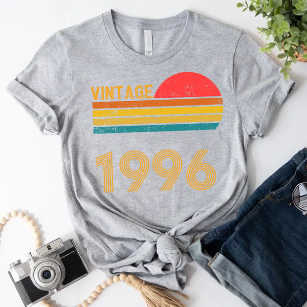 May include a personalized vintage-style t-shirt with a retro sun graphic and customizable year text printed on the front.