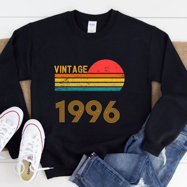 May include a personalized vintage-style sweatshirt with a retro sun graphic and customizable year text printed on the front.