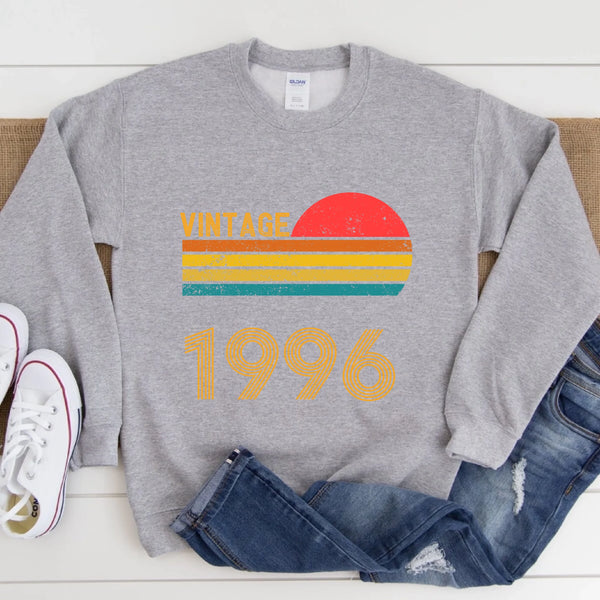 May include a personalized vintage-style sweatshirt with a retro sun graphic and customizable year text printed on the front.