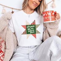 May include an O Come Let Us Adore Him Comfort Colors Christmas T-Shirt featuring a Christian holiday message inspired by a beloved Christmas hymn, designed for church services, family gatherings, worship events, and meaningful seasonal gifting.
