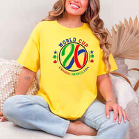 May include a person wearing a Daisy colored 2026 World Cup T-shirt featuring bold soccer graphic and relaxed fit.
