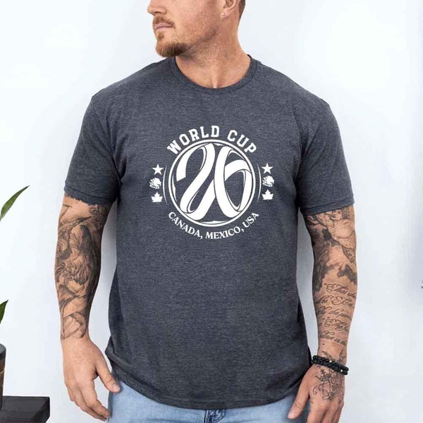 May include a person wearing a Dark Heather colored 2026 World Cup T-shirt featuring bold soccer graphic and relaxed fit.