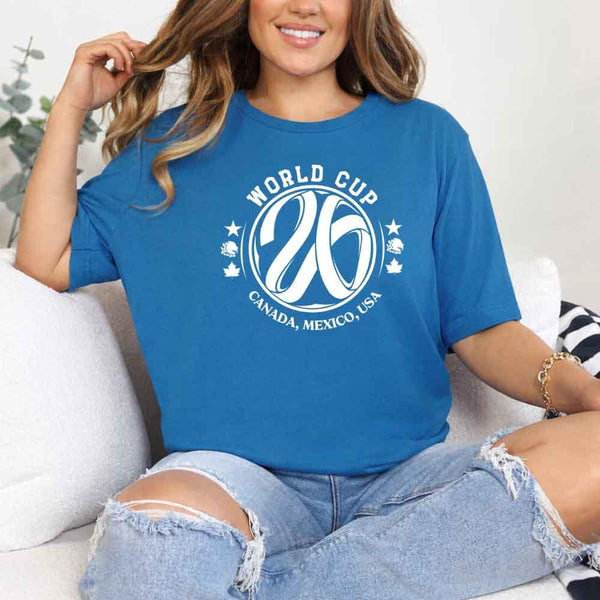 May include a person wearing a Sapphire colored 2026 World Cup T-shirt featuring bold soccer graphic and relaxed fit.