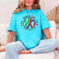 May include a person wearing a Turquoise colored 2026 World Cup T-shirt featuring bold soccer graphic and relaxed fit.