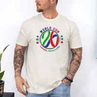 May include a person wearing a Soft Cream colored 2026 World Cup T-shirt featuring bold soccer graphic and relaxed fit.