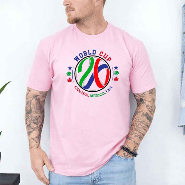 May include a person wearing a Pink colored 2026 World Cup T-shirt featuring bold soccer graphic and relaxed fit.