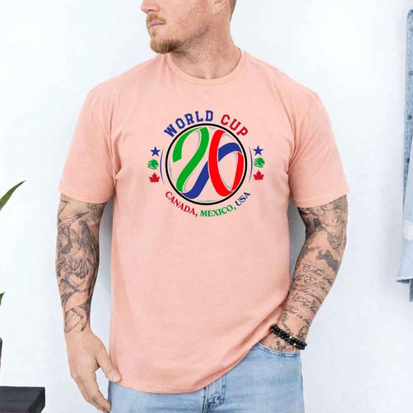 May include a person wearing a Peach colored 2026 World Cup T-shirt featuring bold soccer graphic and relaxed fit.