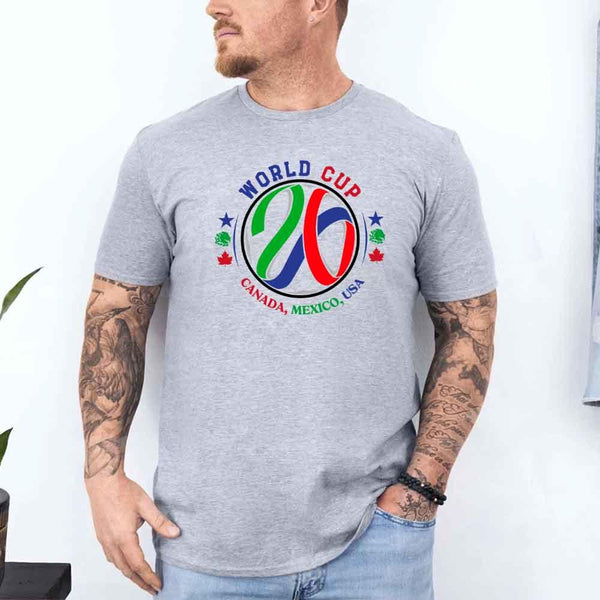 May include a person wearing a Sport Grey colored 2026 World Cup T-shirt featuring bold soccer graphic and relaxed fit.
