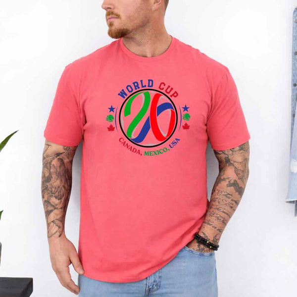 May include a person wearing a Coral Silk colored 2026 World Cup T-shirt featuring bold soccer graphic and relaxed fit.