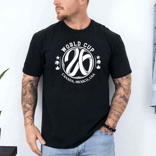 May include a person wearing a Black colored 2026 World Cup T-shirt featuring bold soccer graphic and relaxed fit.