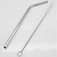 Reusable metal straw with angled tip and cleaning brush on white background
