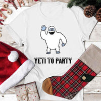 May include a Christmas graphic tee featuring a friendly yeti and festive text displayed on a flat surface.