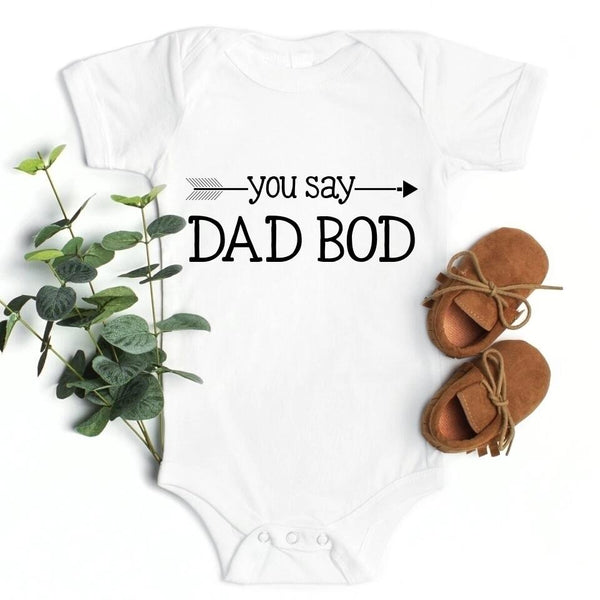 May include a person wearing a funny dad graphic t-shirt with the phrase “You Say Dad Bod, I Say Father Figure”.