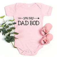 May include a person wearing a funny dad graphic t-shirt with the phrase “You Say Dad Bod, I Say Father Figure”.