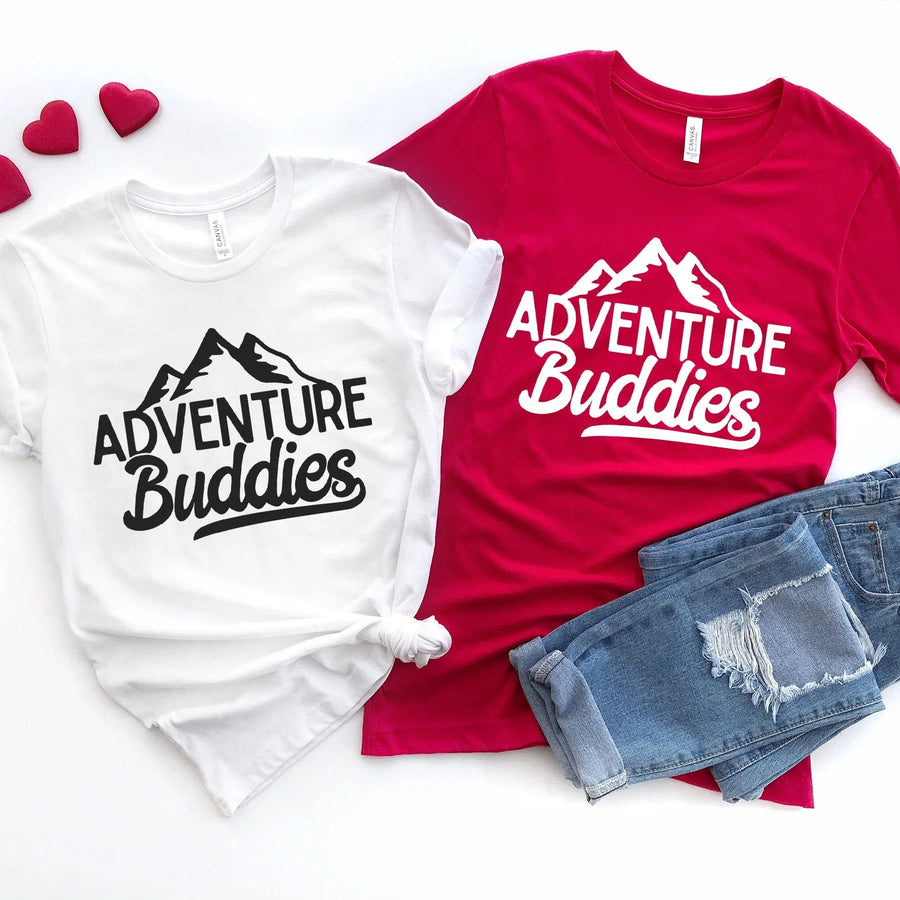 Adventure Buddies matching graphic tees in white and red with mountain design, casual style
